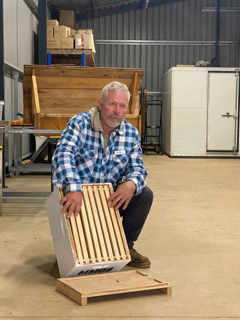 Farm manager Joel Deveson shares his knowledge about blueberries and pollination during the field day. 