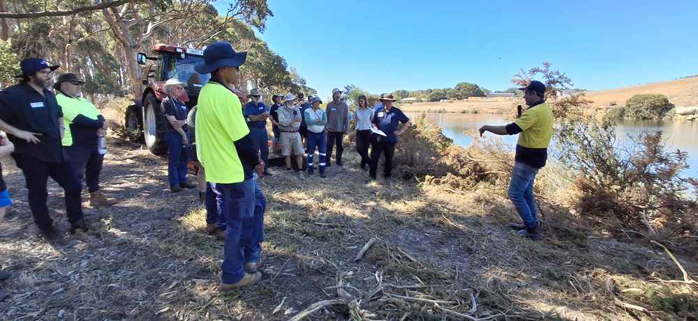 Tim Bligh (right) explains mechanical methods of controlling gorse.