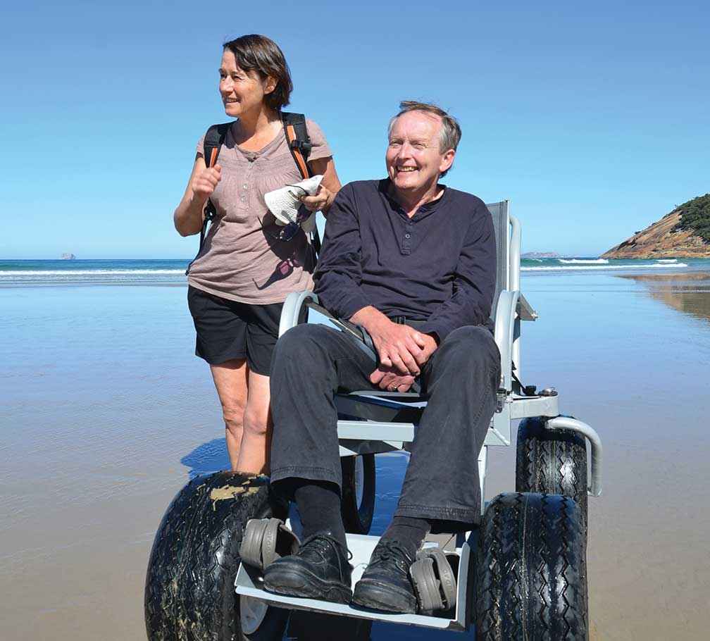 Ros Hart and David Stratton enjoy using a Parks Victoria beach wheelchair at Wilsons Promontory National Park.