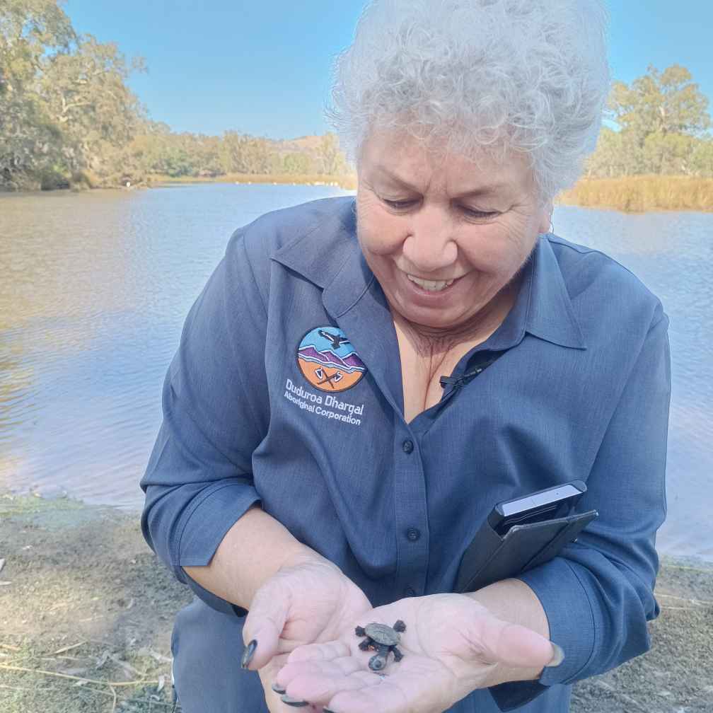 Aunty Valda Murray with turtle hatchlings at Ryans Lagoon, Wodonga.