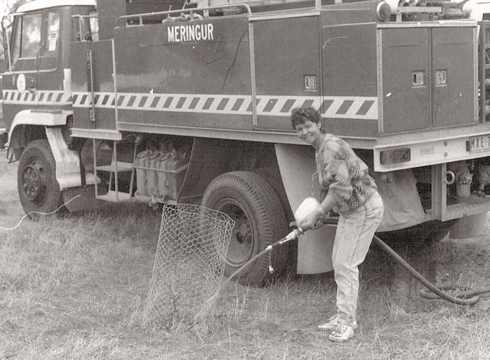 Long-term member of the Millewa-Carwarp Landcare Group Lyn Harmer watering trees in the mid 1990s.