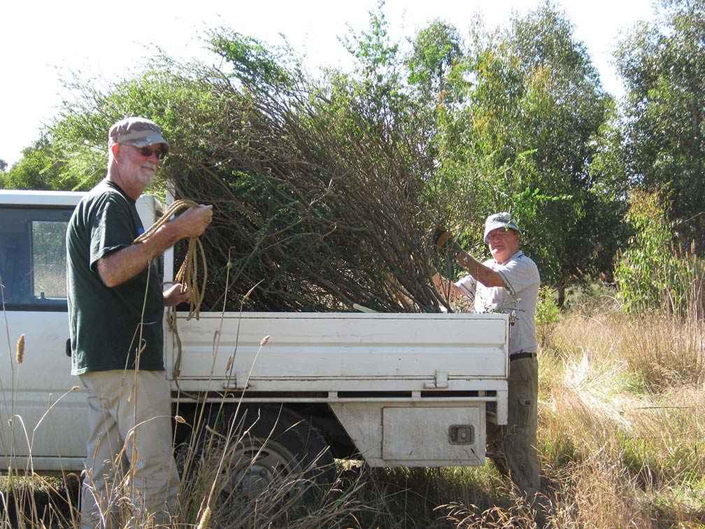 Deep Creek Landcare Group Treasurer Steven Hendy (left) and then President John Anderson during a weed and rubbish removal working bee at Sheehans Crossing in 2010. 